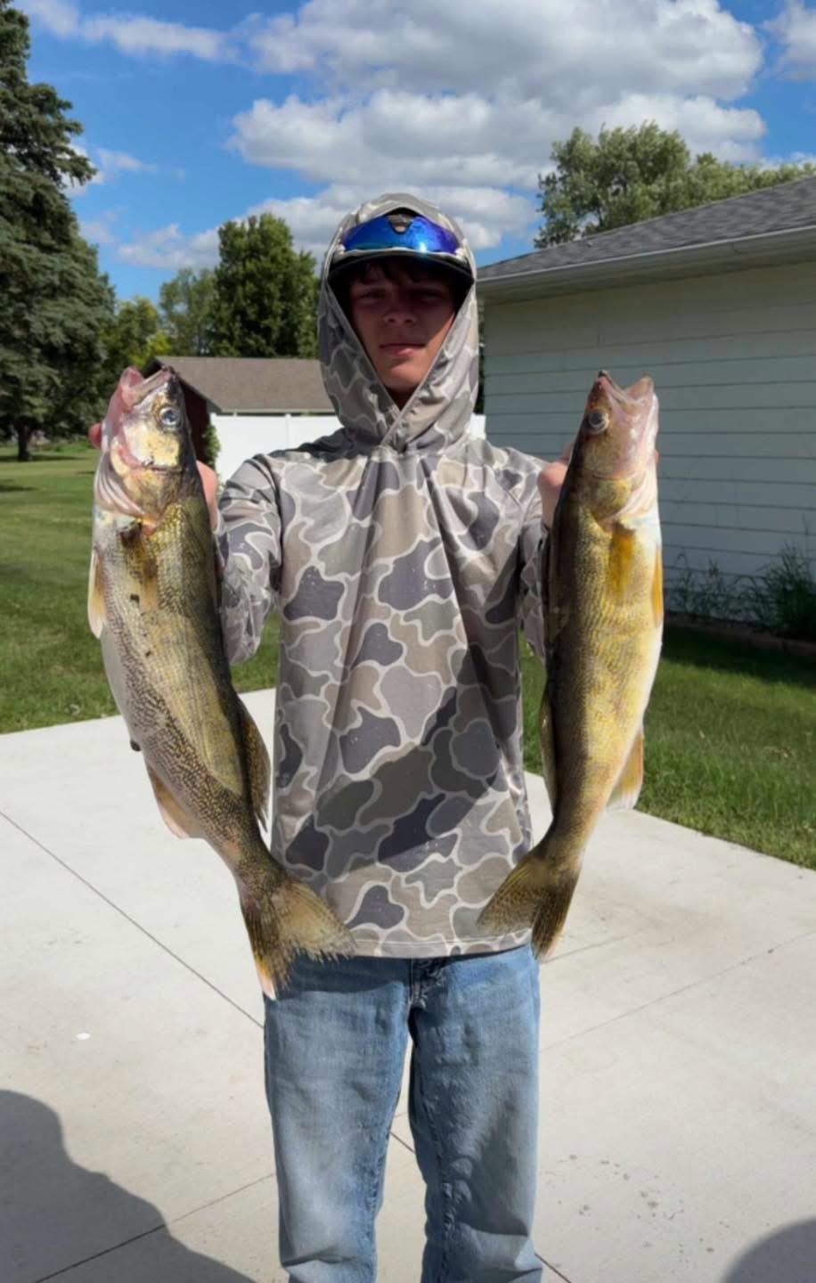 Caden Loy with a walleye at Bitter Lake, Waubay South Dakota